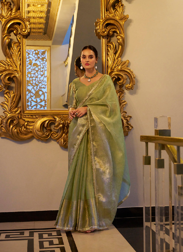 Classic Pista green TIssue shimmer saree with zari weaving and sequin lace.